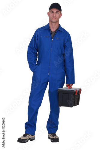 Photo: Man arriving at work with tool box Man arriving at work with tool box