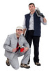 A team of tradesmen posing with their tools