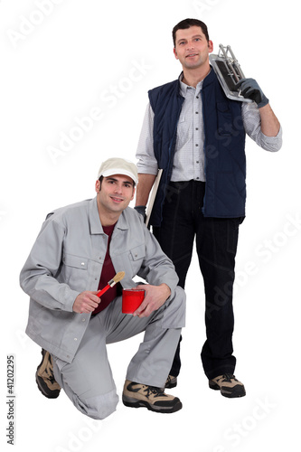 Photo: A team of tradesmen posing with their tools A team of tradesmen posing with their tools