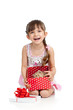 happy child girl holding gift box with kitten