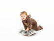 baby dressed teddy suit, on white background