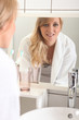 Woman reflected in mirror