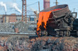 The molten slag is poured from a cup
