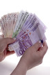 hands hold money euro on the white backgeound