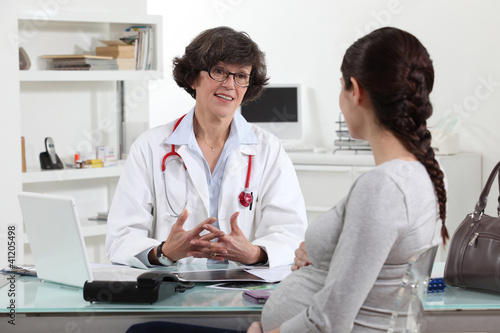 Photo: Pregnant woman in doctors appointment Pregnant woman in doctors appointment