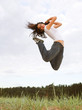 beautiful girl jumping in the park