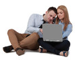Young couple working on a laptop