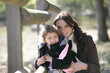 Woman and child by a paddock