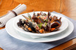 bowl with cooked mussels