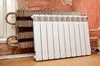 real photo of installation of a radiator