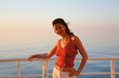 Happy lady on liner at sunrise six o`clock Happy lady on liner at sunrise six o`clock