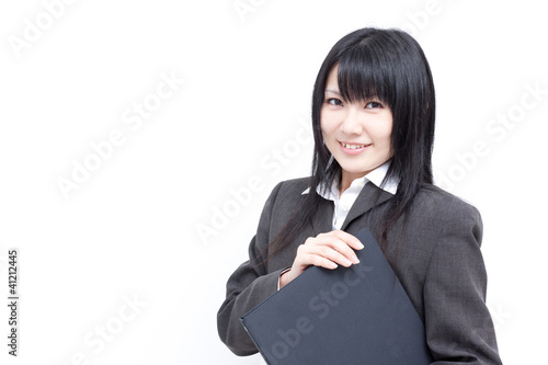 Foto: ファイルを持った女性 ファイルを持った女性