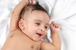 Smiling Baby on white satin background