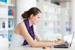 pretty female college student studying in the university library