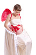 Photo: young pregnant woman with red wings young pregnant woman with red wings