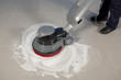 cleaning floor with machine