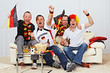 Foto: german soccer fans on the sofa german soccer fans on the sofa