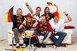 Foto: german soccer fans on the sofa german soccer fans on the sofa