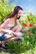 beautiful girl with flowers in garden beautiful girl with flowers in garden