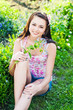 beautiful girl with flowers in garden beautiful girl with flowers in garden