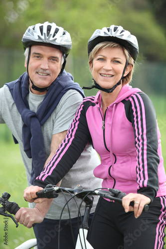 Photo: Senior couple having a bike ride Senior couple having a bike ride