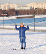 girl standing on skis with ski poles
