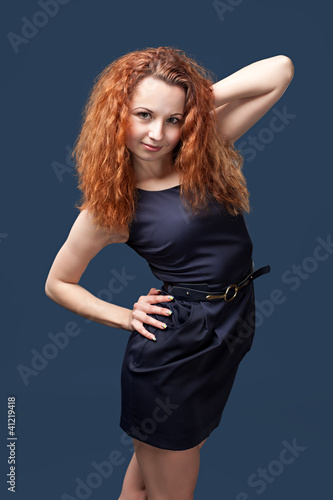 Photo: Redhead girl posing in studio Redhead girl posing in studio