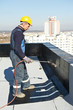 Flat roof covering works with roofing felt