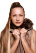 woman with long straight hair in brown jacket