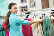 Young woman at shirts clothes shopping