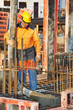builder worker at concrete pouring work
