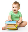 Portrait of a cute little boy with books