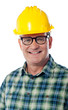 Closeup of senior architect in hardhat, smiling