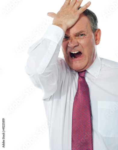 Photo: Cropped image of a disturbed businessman Cropped image of a disturbed businessman
