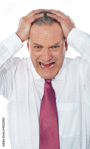 Photo: Portrait of businessman expressing frustration Portrait of businessman expressing frustration