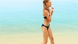 Young woman spending free time on the tropical beach