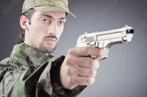 Photo: Soldier with gun in studio shooting Soldier with gun in studio shooting