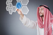 canvas print picture - Young arab pressing virtual buttons