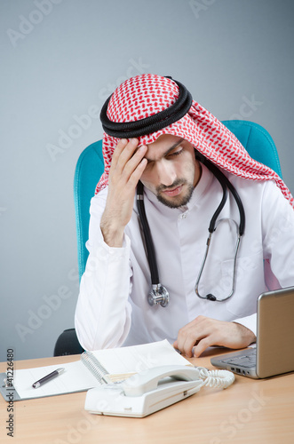 Photo: Arab doctor working in hospital Arab doctor working in hospital