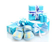 beautiful gifts and baby's bootees isolated on white