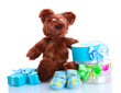 beautiful gifts, baby's bootees and bear toy  isolated on white