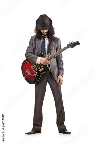 Photo: Young guitar player isolated on white Young guitar player isolated on white