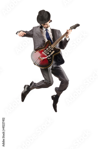Photo: Young guitar player isolated on white Young guitar player isolated on white