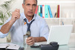 Office worker eating from tin can