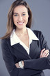 Attractive businesswoman with her arms crossed.