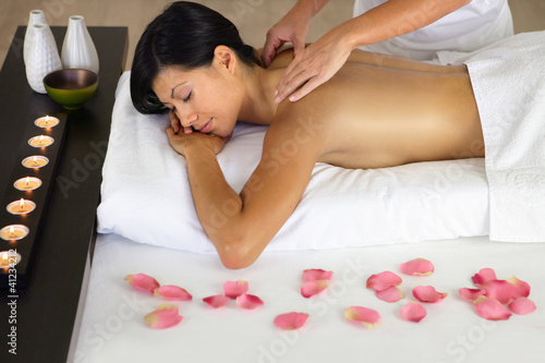 Photo: Woman enjoying a back massage Woman enjoying a back massage