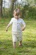 boy walking on meadow