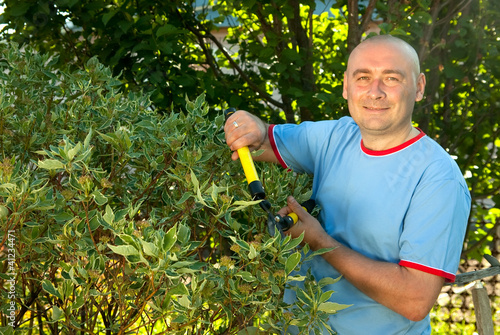 Photo: man with garden pruner man with garden pruner