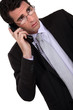 Concerned businessman talking on the phone
