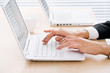 Female hands on laptop